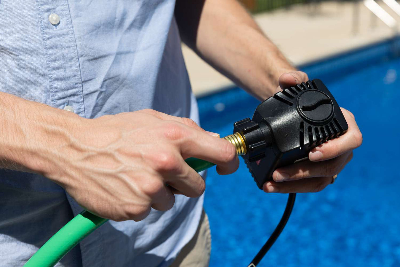 A man operating a DIY portable water pump.